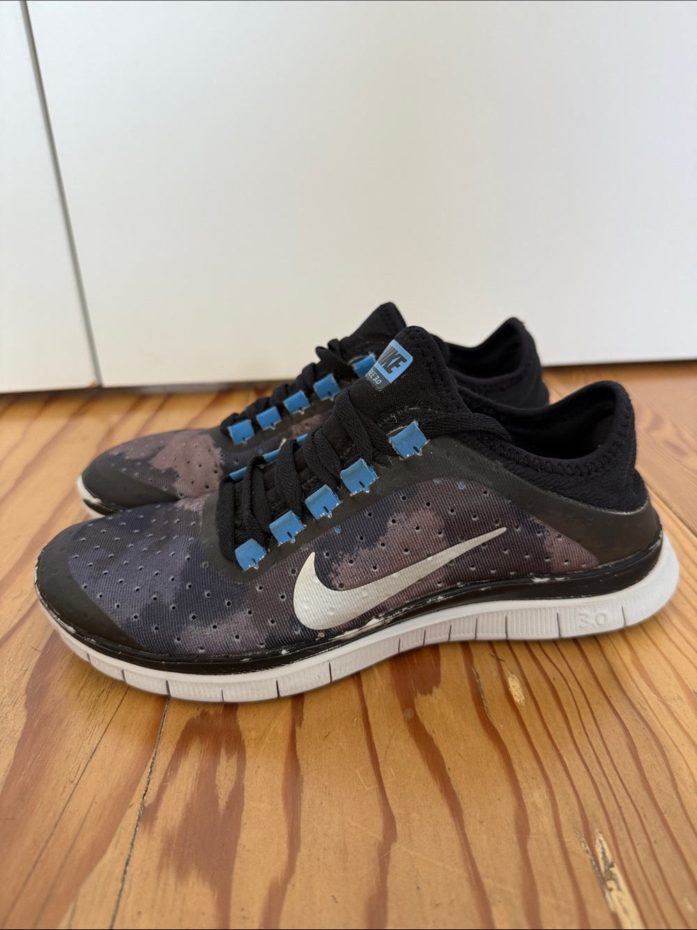 Nike Free 3.0 Women’s Black Athletic Shoes with Blue Accents and White Swoosh